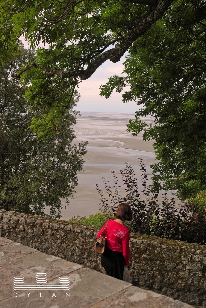 Mont St Michel - lady in red 2